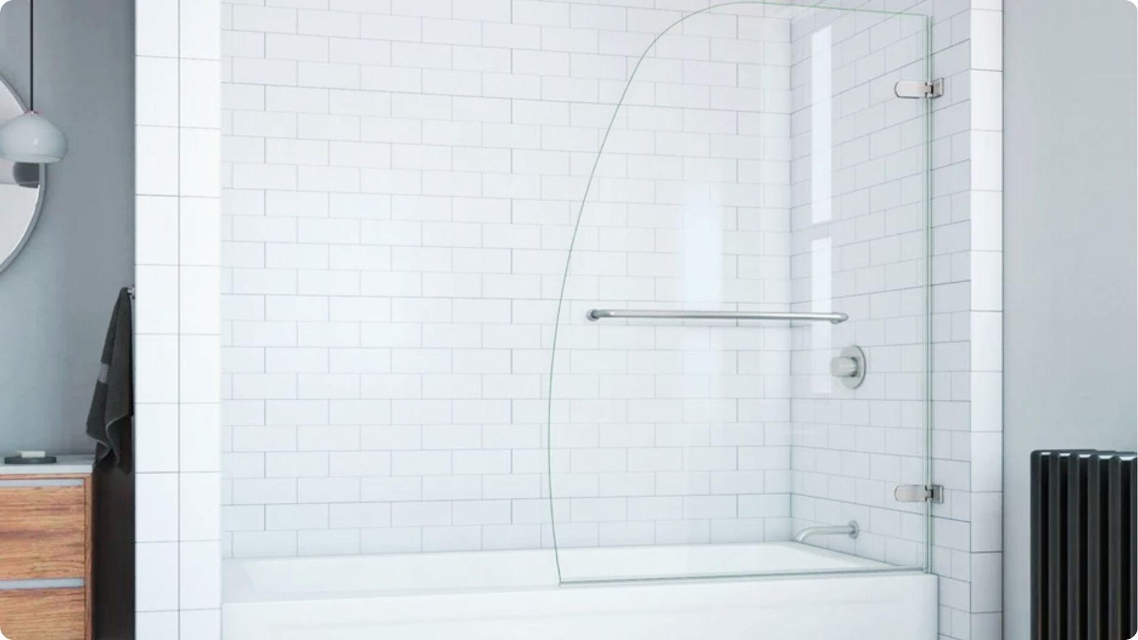 Curved half glass shower door with towel bar installed on a white subway tile bathtub surround.