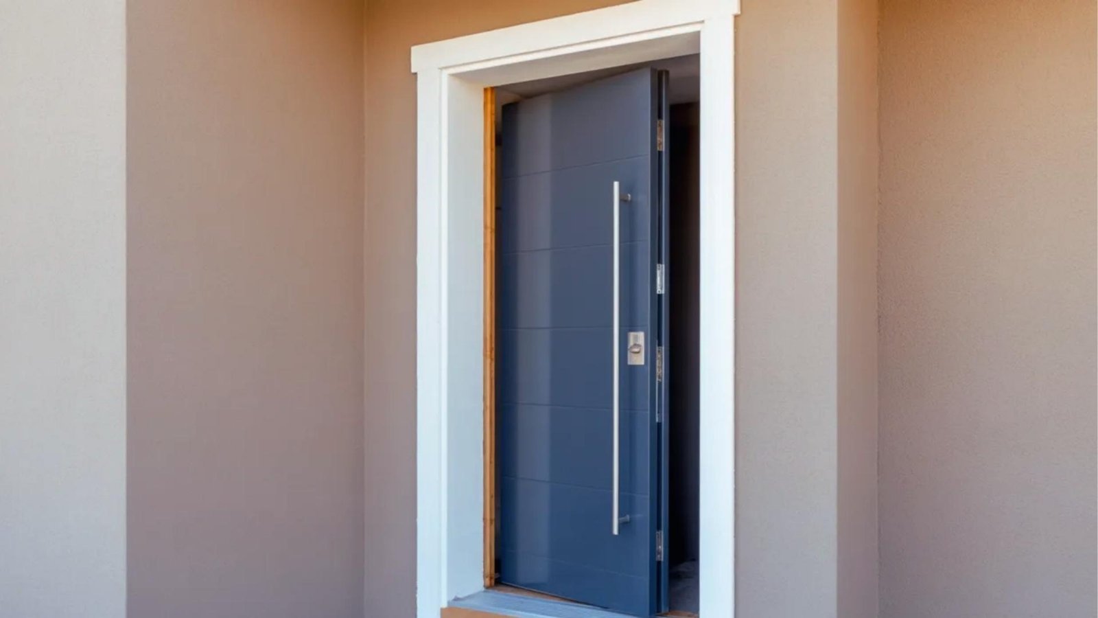 Realistic exterior home showing front door installation with clean frame and simple renovation stage.