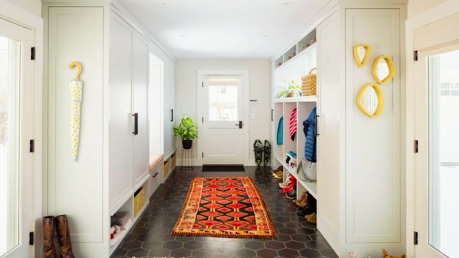 Mudroom style farmhouse board and batten entryway with storage.