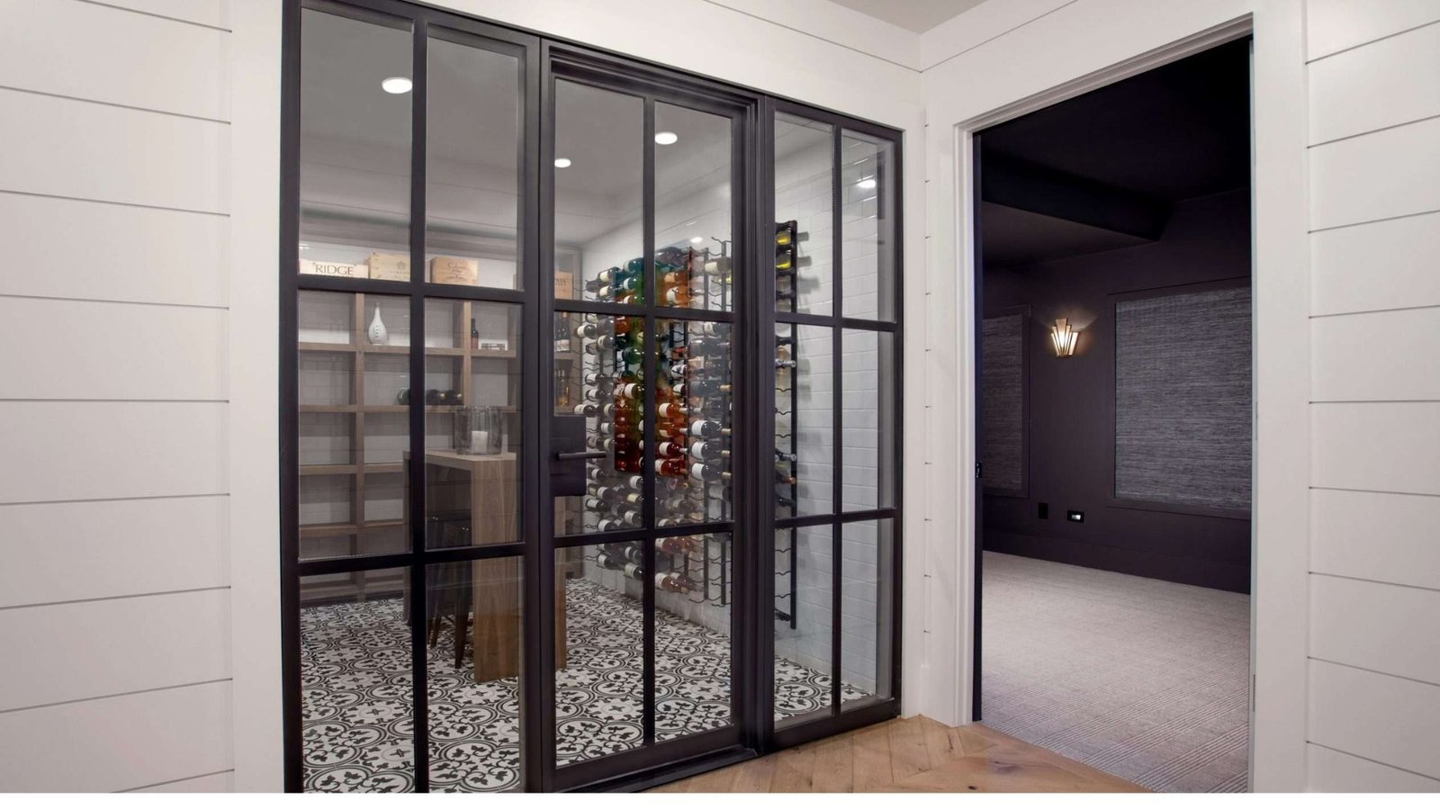 Black steel frame doors on a laundry closet.