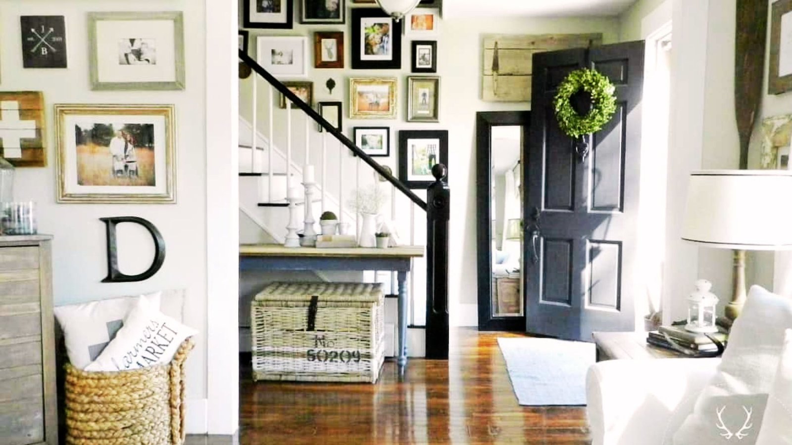Farmhouse gallery wall styled above board and batten paneling.