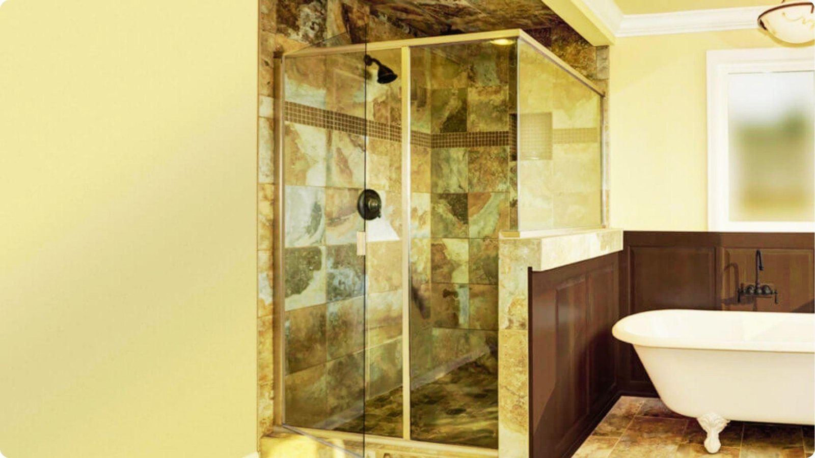 Traditional bathroom with a neo-angle semi frameless shower enclosure beside a clawfoot tub.