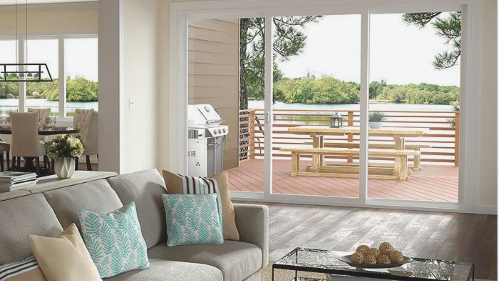 A cozy living room featuring a couch, coffee table, and sliding glass doors leading to an outdoor space.